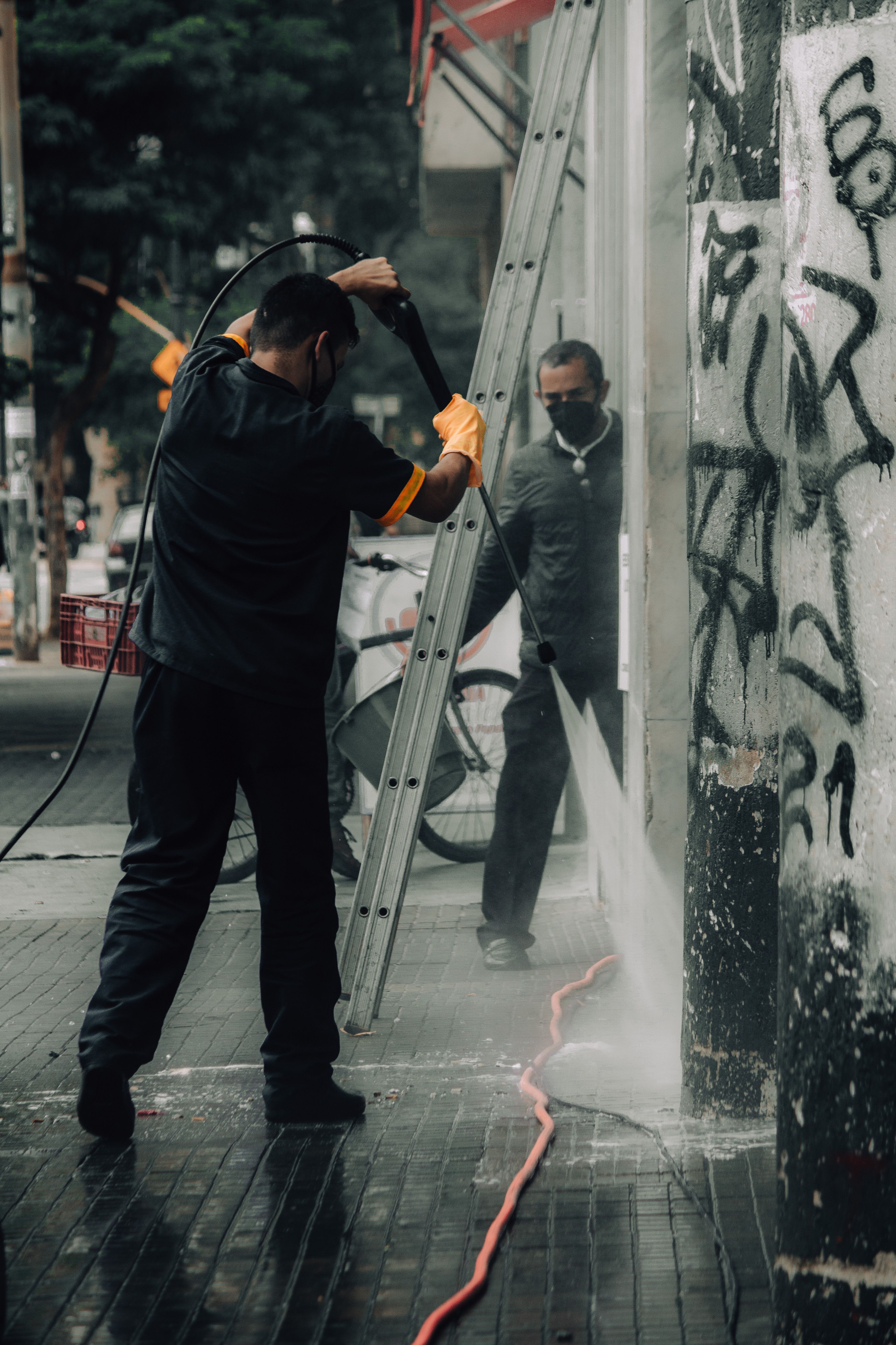 High-pressure washing of an exterior wall